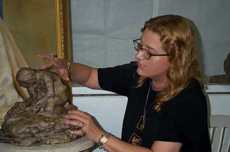 yoyita sculpting a child playing with marbles sculpture