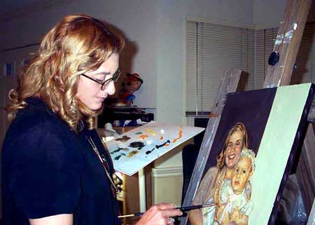 yoyita painting a portrait